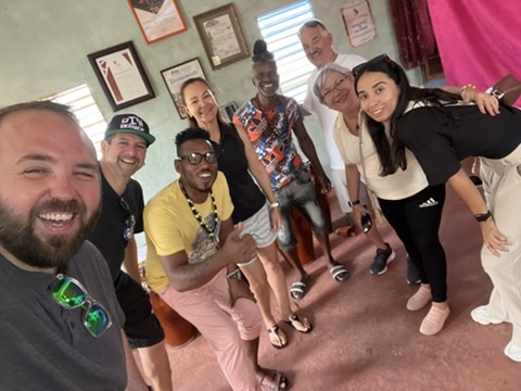 PHoto with our HMT clients and los muñequitos de matanzas